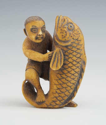 Carved Ivory Netsuke of a Man with Fish