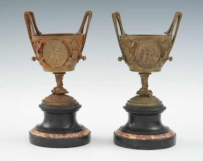 A Pair of Small Bronze Urns on