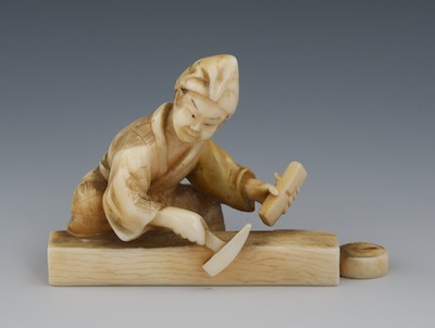 A Carved Ivory Miniature of a Carpenter