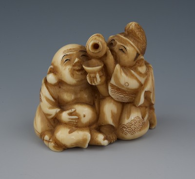 A Carved Ivory Netsuke of a Two