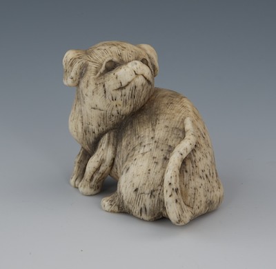 A Carved Bone Netsuke of a Dog 13288b