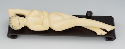 A Carved Ivory Doctors Model Reclining