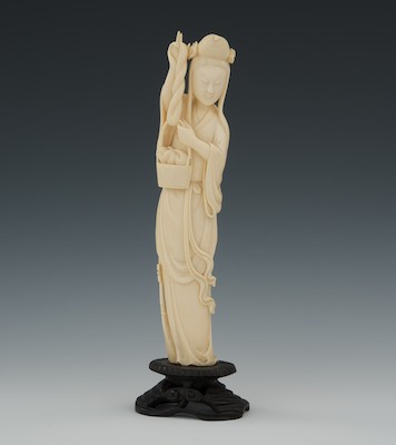 A Carved Ivory Weaver Standing female