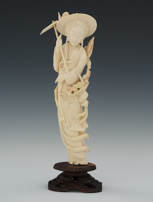 A Carved Ivory Gardener Standing female