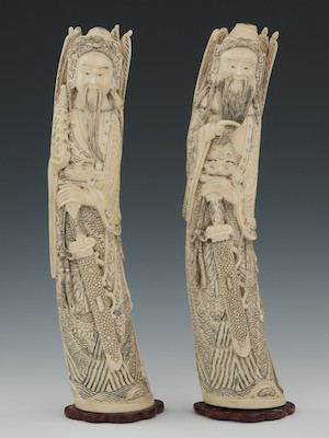 A Pair of Carved Ivory Figures A pair