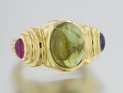 An 18k Gold Peridot Sapphire and