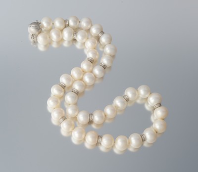 A Cultured Pearl and Diamond Enhancer 132a7d