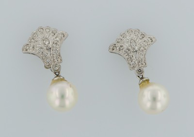 A Pair of Diamond and Pearl Earrings