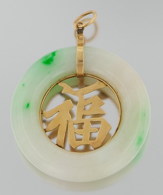 A Carved Jadeite and Gold Pendant 132b11