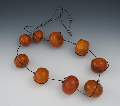 A String of Nine Large Amber Bead 132b3d