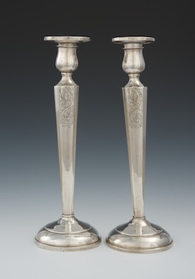 A Pair of Weighted Sterling Silver Candlesticks