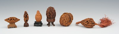 A Group of Walnut and Olive Carvings