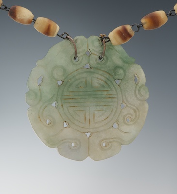 Carved Jade Pendant with Horn Bead