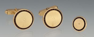A Set of Gold and Garnet Cufflinks and
