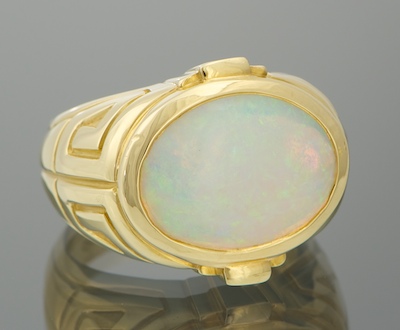 A Ladies' 18k Gold and White Opal