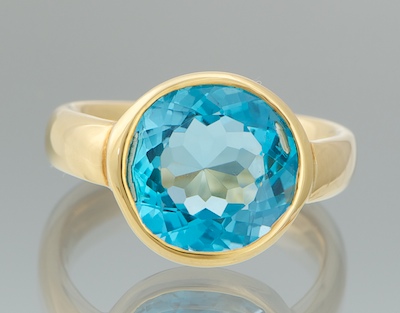 A Ladies' Blue Topaz and 18k Gold