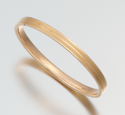 A Ladies' Gold Bangle Bracelet