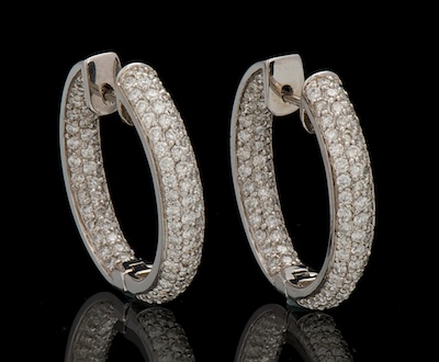 A Pair of Diamond Hoop Earrings 133121