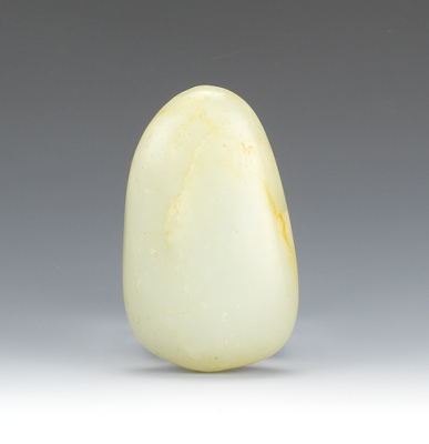 A Carved Jade Pebble Form Softly
