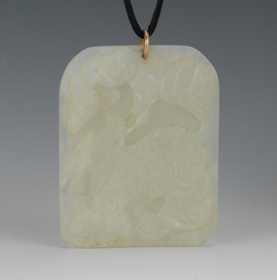 A Carved Jade Medallion Carved pale