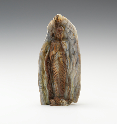 A Carved Petrified Wood Buddha