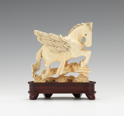 A Carved Ivory Figure of Pegasus