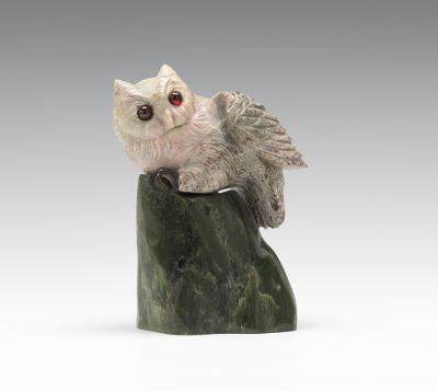 A Carved Stone Owl on a Rock Realistically