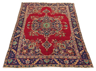 A Tabriz Area Carpet Bright red field