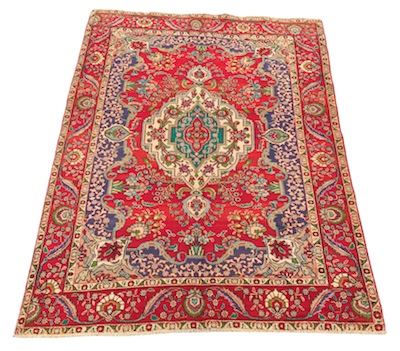 A Tabriz Carpet Bright red ground