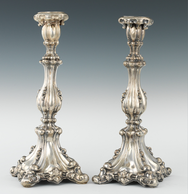A Pair of Silver Candlesticks Elaborately