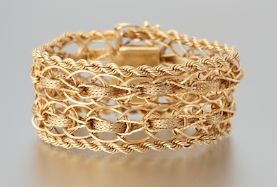 A Ladies' 14k Gold Strap Bracelet