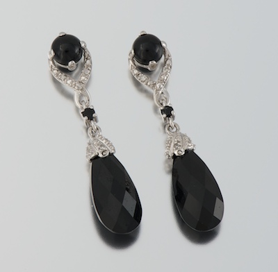 A Pair of Onyx and Diamond Earrings