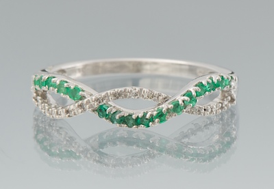 A Ladies Diamond and Emerald Ring 133614