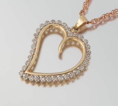 A Ladies Diamond Heart Pendant on Chain