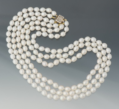 A Triple Strand Pearl Necklace Individually