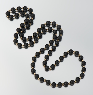 A Ladies' Onyx and Gold Bead Necklace