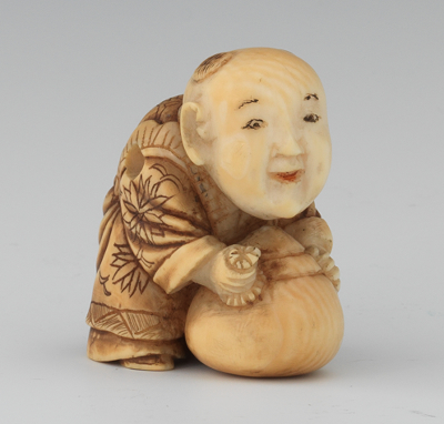 A Carved Ivory Netsuke of a Pot