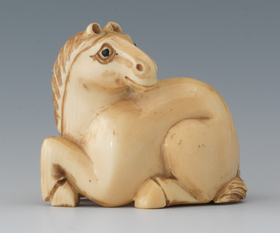 A Carved Ivory Netsuke of a Horse
