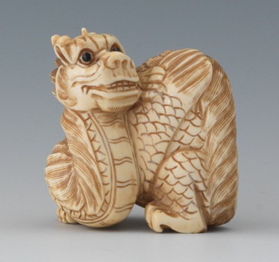 A Carved Ivory Netsuke of a Dragon 133655