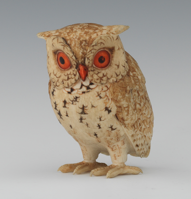 A Carved Ivory Figurine of an Owl