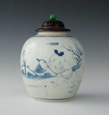 A Chinese Porcelain Jar With Carved