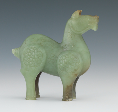 A Chinese Carved Jade Archaic Style