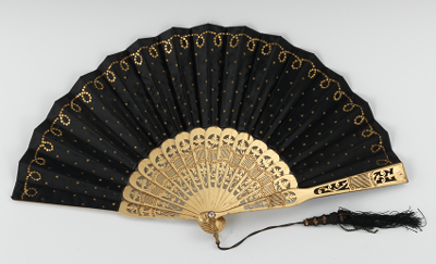 A Gilt Wood and Black Satin Hand