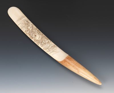 A Carved Ivory Page Turner Intricately