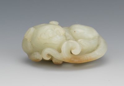 A Carved Jade Recumbent Baby Dragon 131a5a