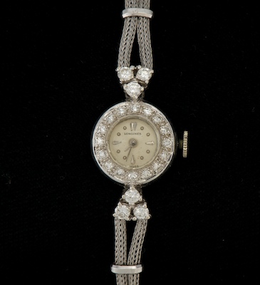 A Ladies' Longines Gold and Diamond