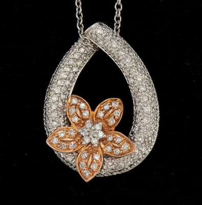 A Ladies Diamond Flower Design Pendant