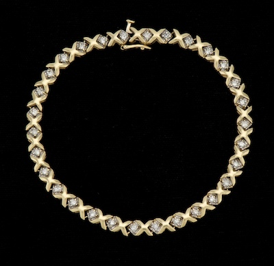 A Ladies Gold and Diamodn XO Bracelet 131bca