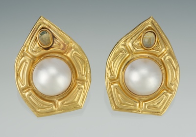 A Pair of Oversized Earrings With