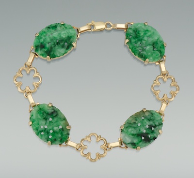 A Lades' Carved Jade and Gold Bracelet